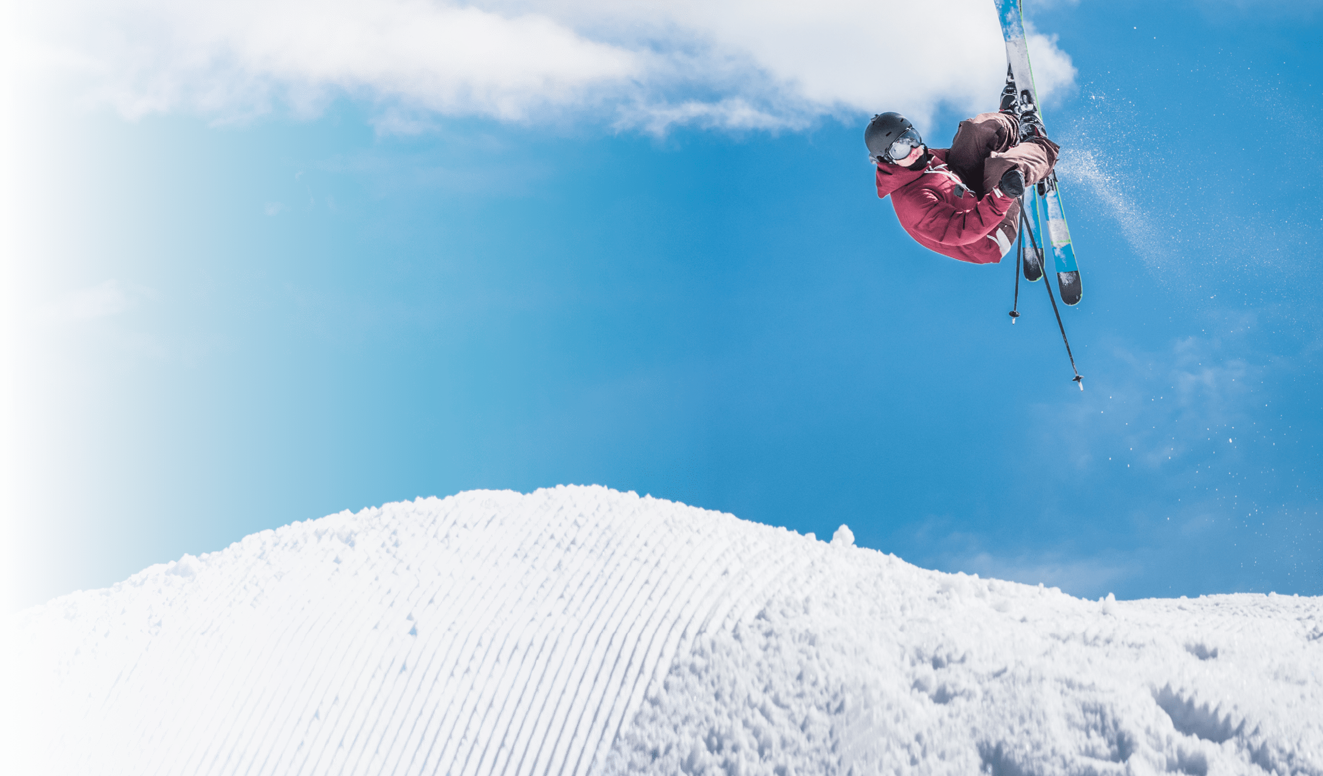 Man doing freestyle ski jumping in air 