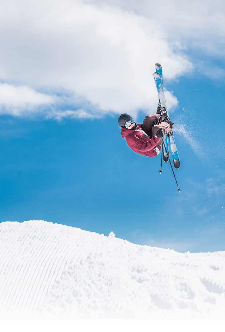 Man doing freestyle ski jumping in air 