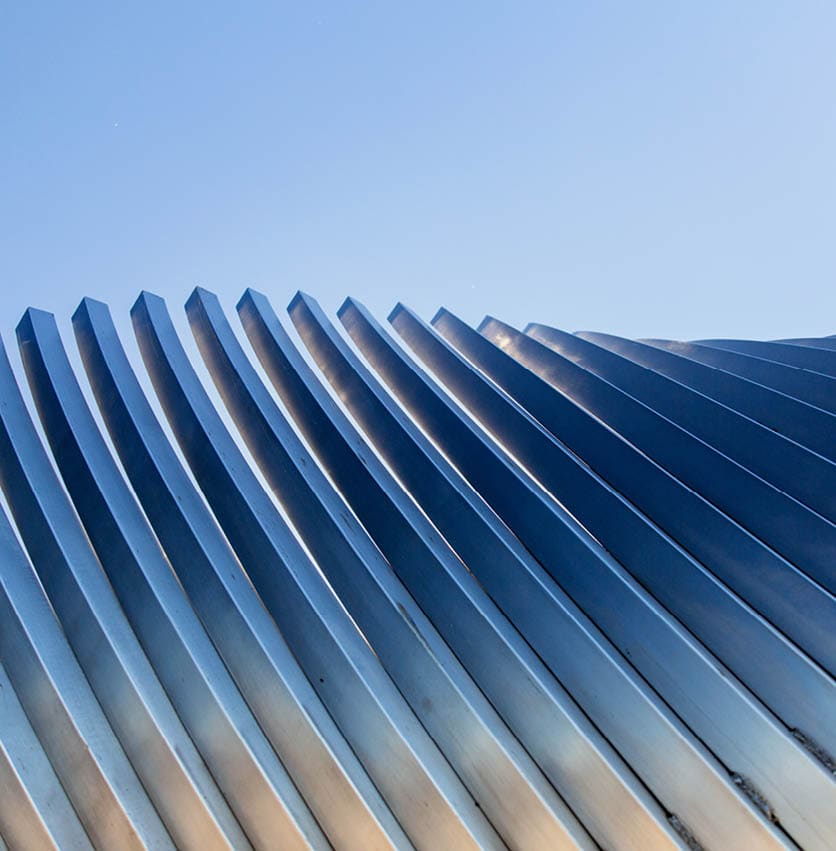 architecture and site concept - close up of modern building construction part over blue sky