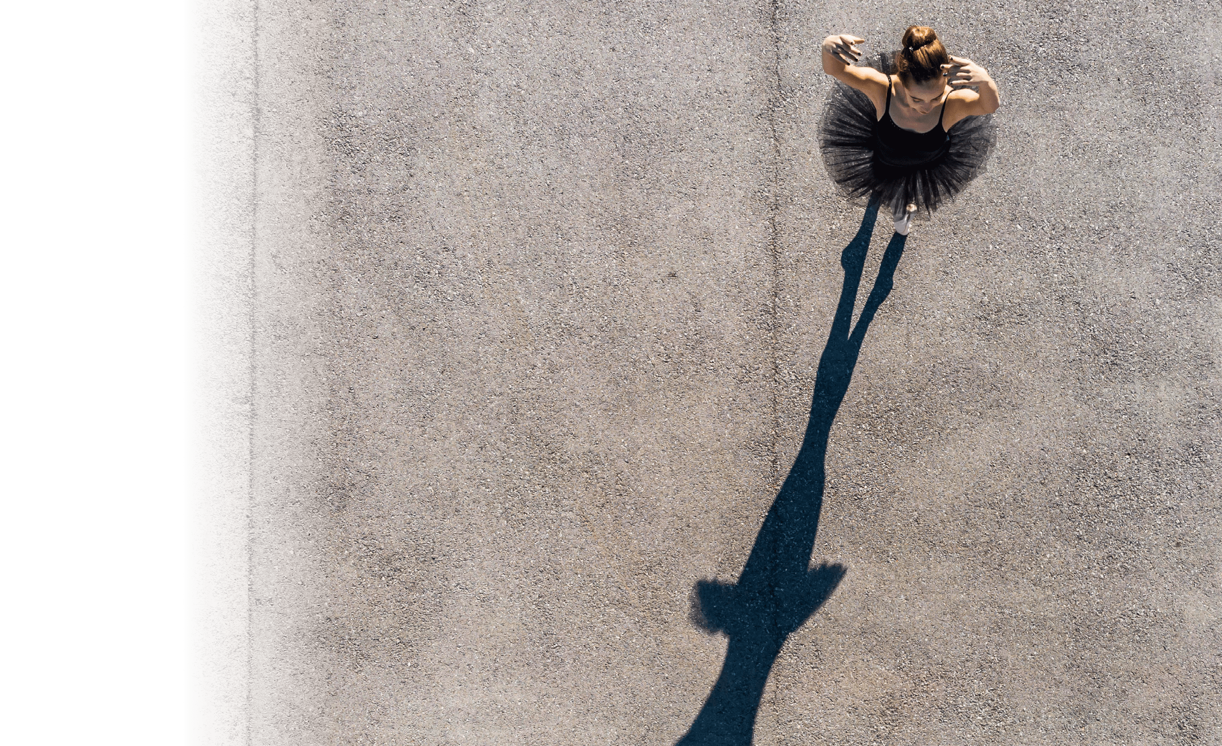 Creative view of ballerina dancing outdoors 