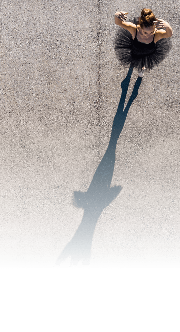 Creative view of ballerina dancing outdoors 