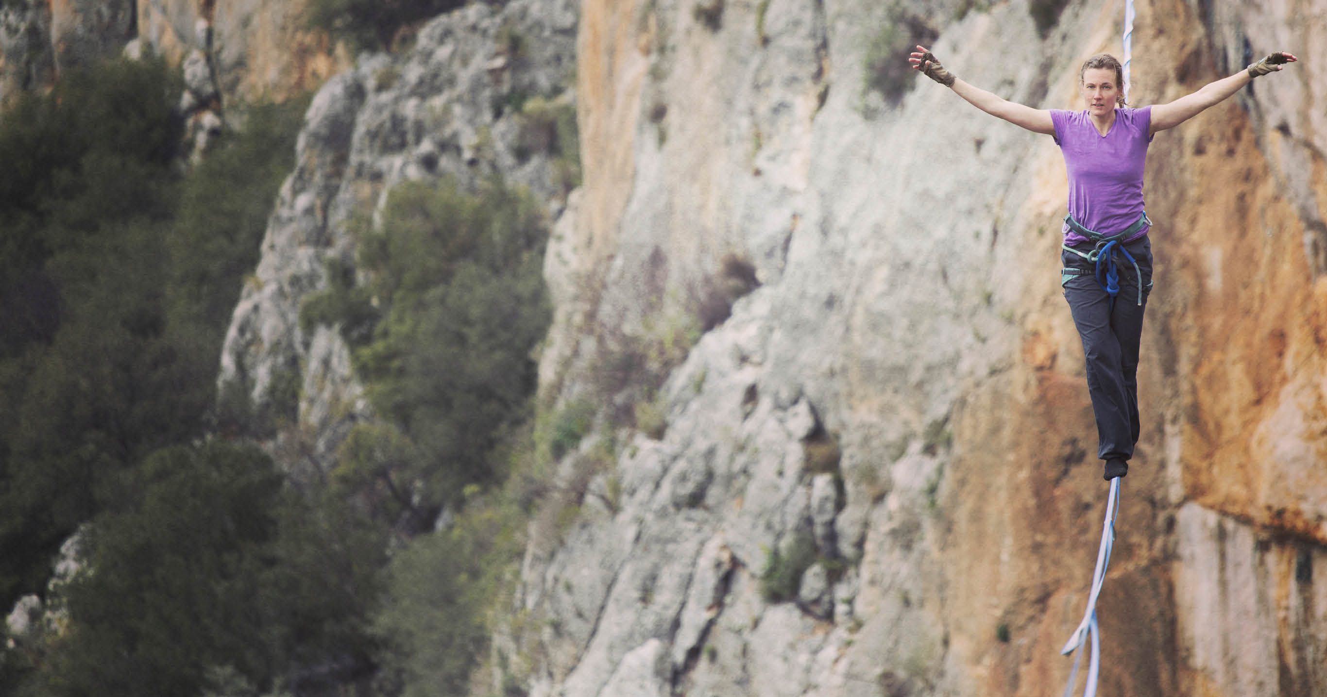 Woman balancing on the rope concept of risk taking and challenge 