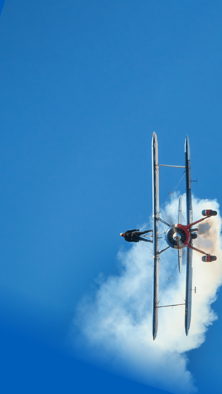 Wing Walker on Biplane come hurling toward the ground