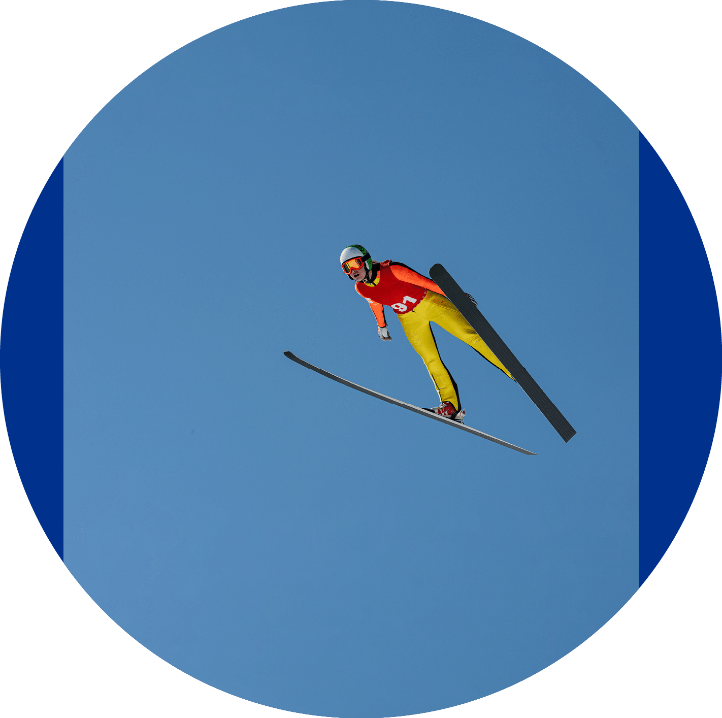 Front view of young female ski jumper during the long ski jump